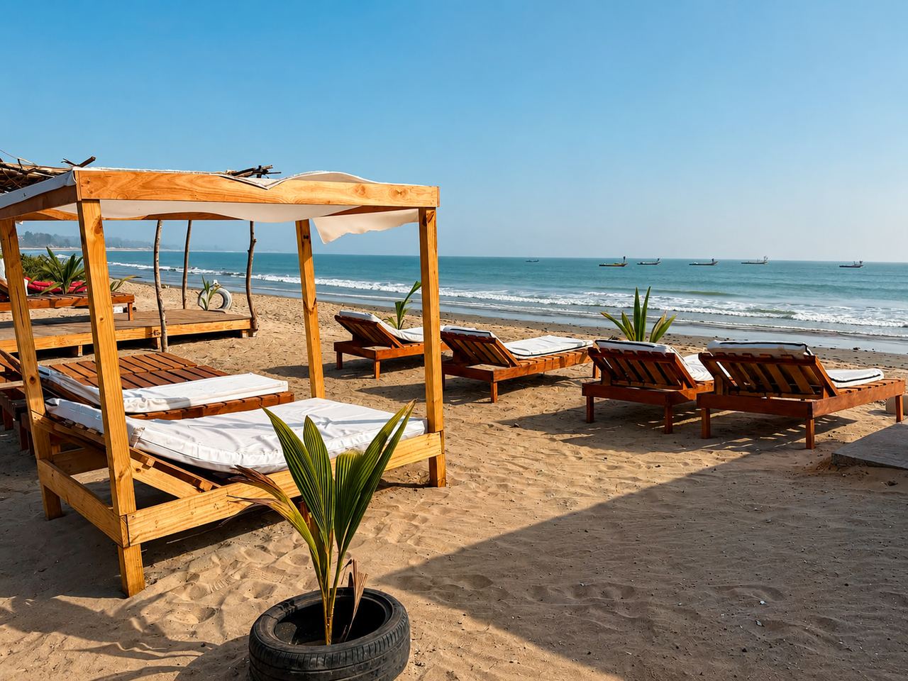 Wooden beach beds and loungers facing the ocean